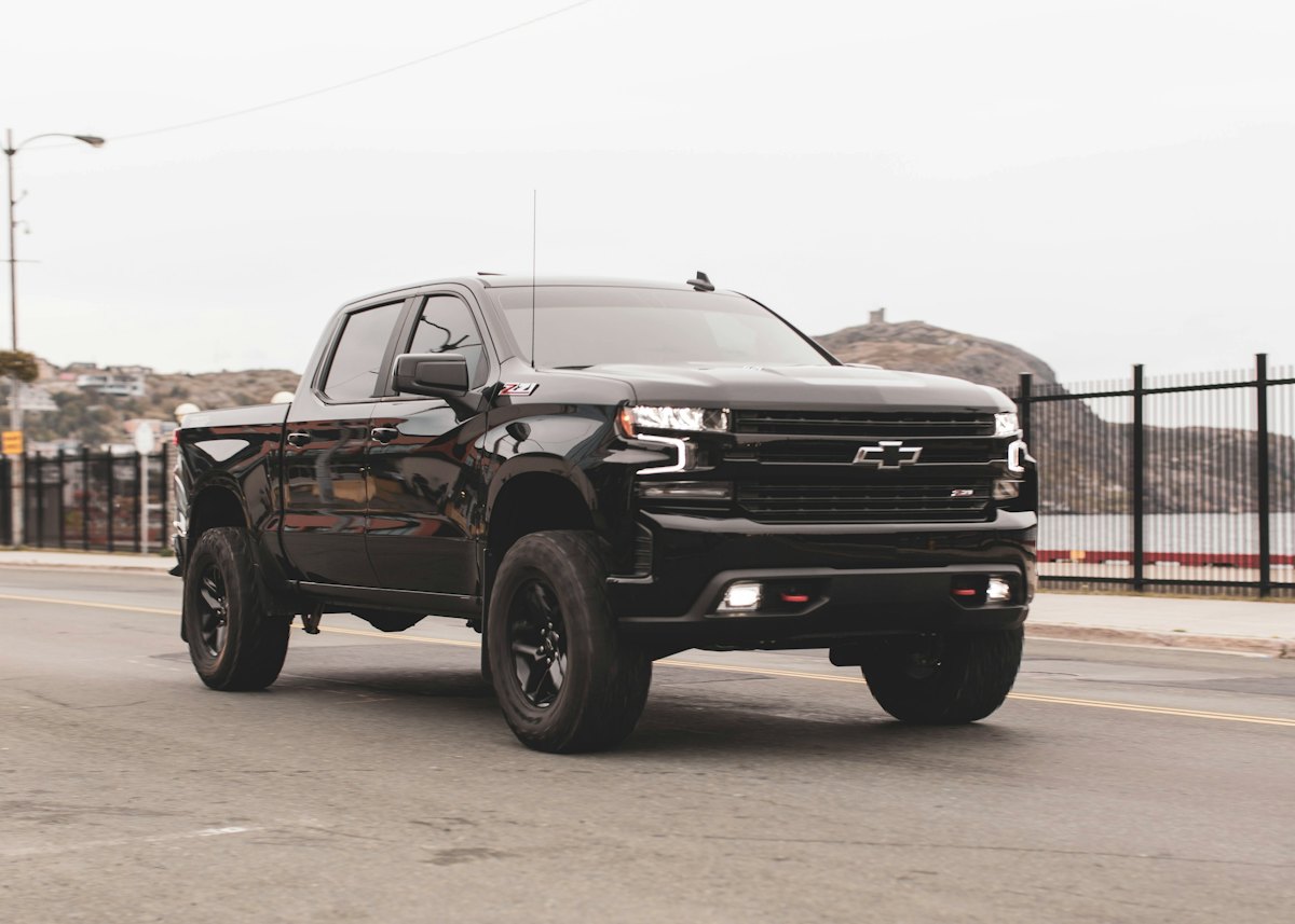 Black pickup truck parked on pavement