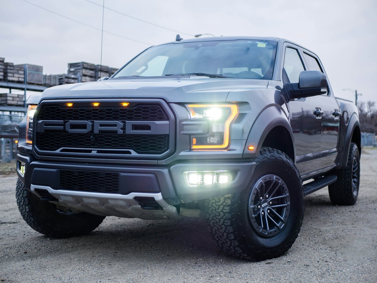Gray off-road pickup truck parked on a street